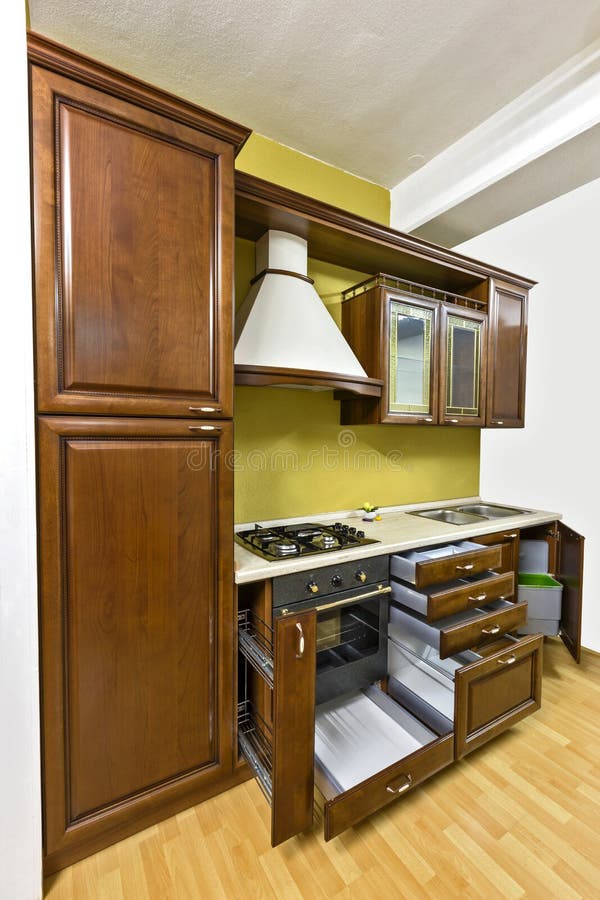 Classic kitchen. Classic, massive kitchen. Cabinets made of quality wood royalty free stock photo
