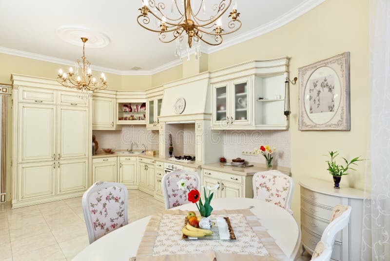 Classic style kitchen and dining room interior. In beige pastoral colors royalty free stock photo